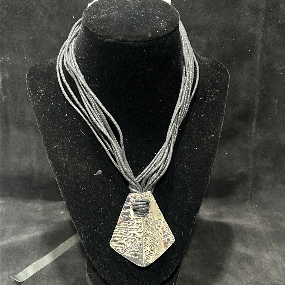 Elegant Silver Pendant Necklace with leather roping